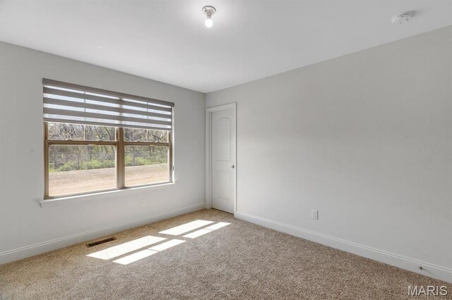 536 Edison Way, Wentzville, MO 63385 - unfurnished room featuring light colored carpet, baseboards, and a smoke detector