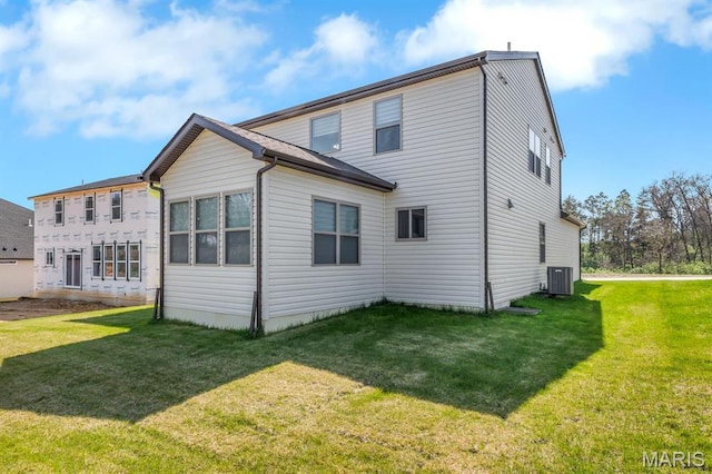 536 Edison Way, Wentzville, MO 63385 - rear view of house featuring central air condition unit and a yard