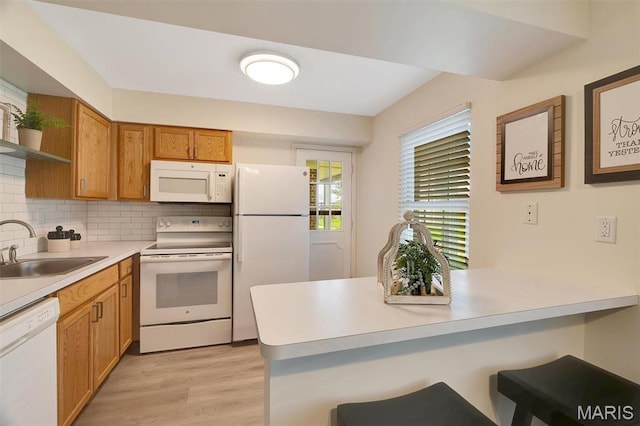 1707 Mayenne Ct Unit B, Saint Louis, MO 63125 - kitchen with white appliances, a sink, open shelves, a peninsula, and a breakfast bar