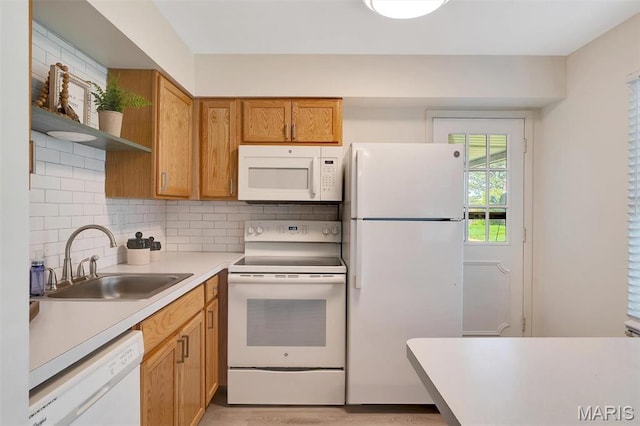 1707 Mayenne Ct Unit B, Saint Louis, MO 63125 - kitchen featuring white appliances, a sink, light countertops, open shelves, and backsplash