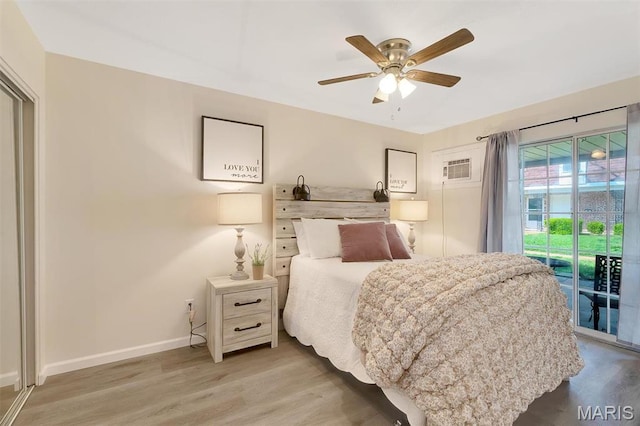 1707 Mayenne Ct Unit B, Saint Louis, MO 63125 - bedroom with access to outside, baseboards, wood finished floors, an AC wall unit, and ceiling fan