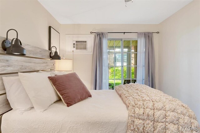 1707 Mayenne Ct Unit B, Saint Louis, MO 63125 - bedroom featuring an AC wall unit and access to outside