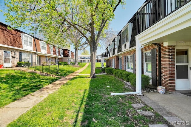 1707 Mayenne Ct Unit B, Saint Louis, MO 63125 - view of grassy yard featuring a residential view