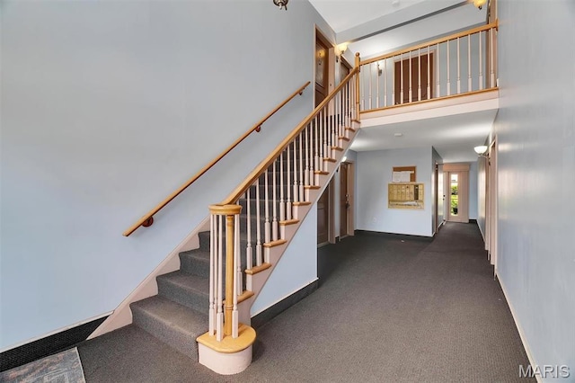 1707 Mayenne Ct Unit B, Saint Louis, MO 63125 - stairs with baseboards, carpet flooring, and a towering ceiling