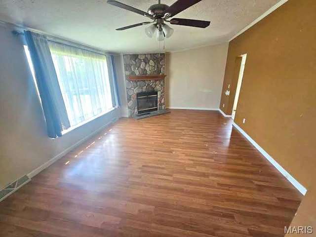 unfurnished living room with a ceiling fan, wood finished floors, and baseboards