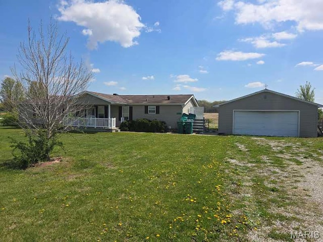 rear view of property with an outdoor structure, a garage, a lawn, and a porch