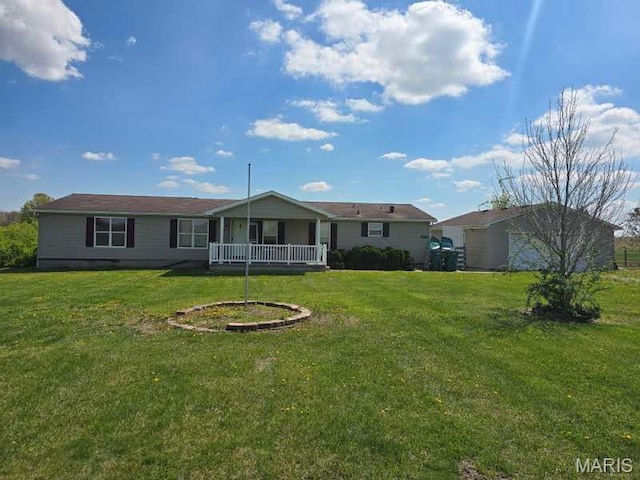 back of house with a yard and a porch