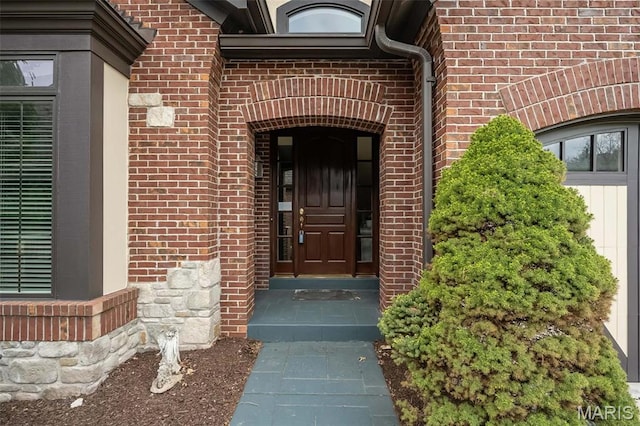 entrance to property with brick siding