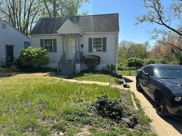 8818 Kendale Dr, Saint Louis, MO 63121 - view of front of house featuring a shingled roof and a front lawn
