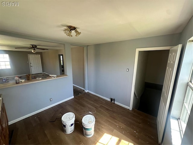 8818 Kendale Dr, Saint Louis, MO 63121 - unfurnished dining area featuring wood finished floors, ceiling fan, and baseboards