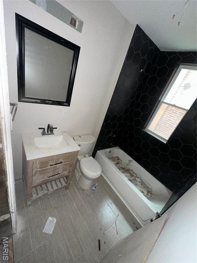 4439 Oakland Ave, Saint Louis, MO 63110 - bathroom with toilet, vanity, a bath, and a shower