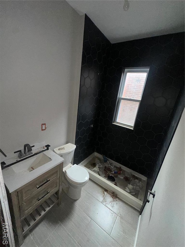 4439 Oakland Ave, Saint Louis, MO 63110 - full bath with toilet, a stall shower, and vanity