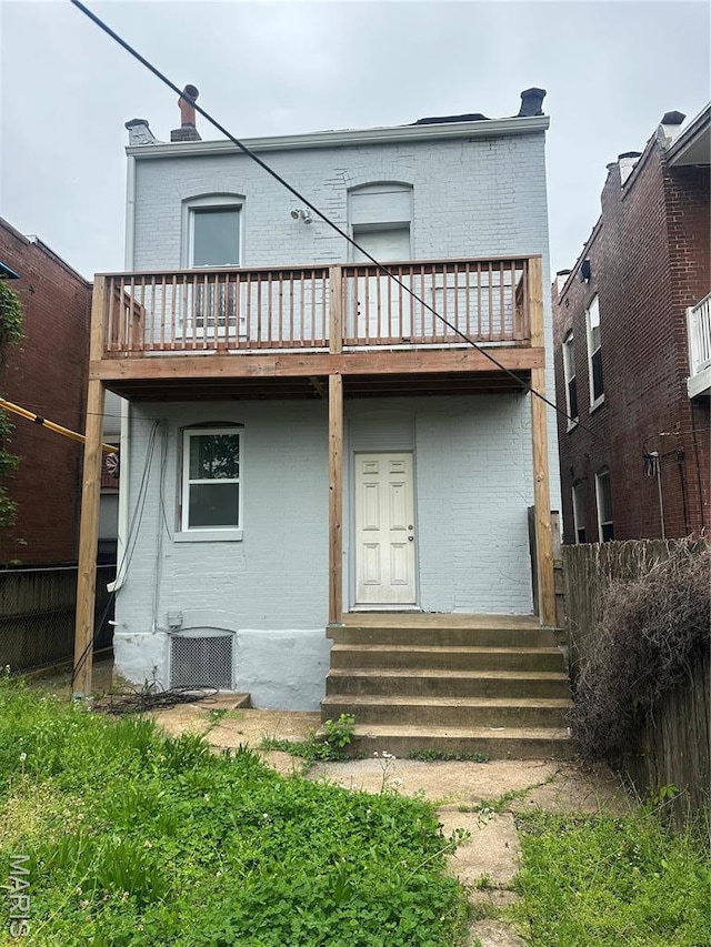 4439 Oakland Ave, Saint Louis, MO 63110 - rear view of property with brick siding, entry steps, and a balcony