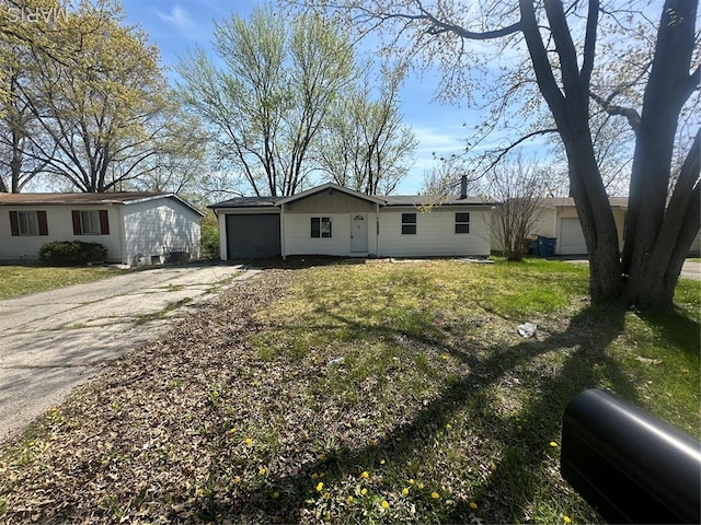 1420 Redman Blvd, Saint Louis, MO 63138 - view of front of house with an attached garage, concrete driveway, and a front yard