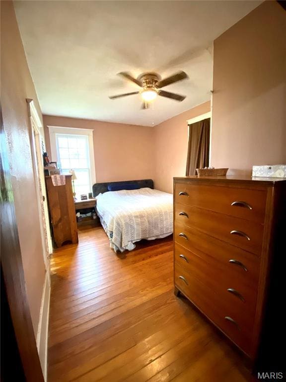 111 SE St, Wellsville, MO 63384 - bedroom with wood-type flooring and ceiling fan