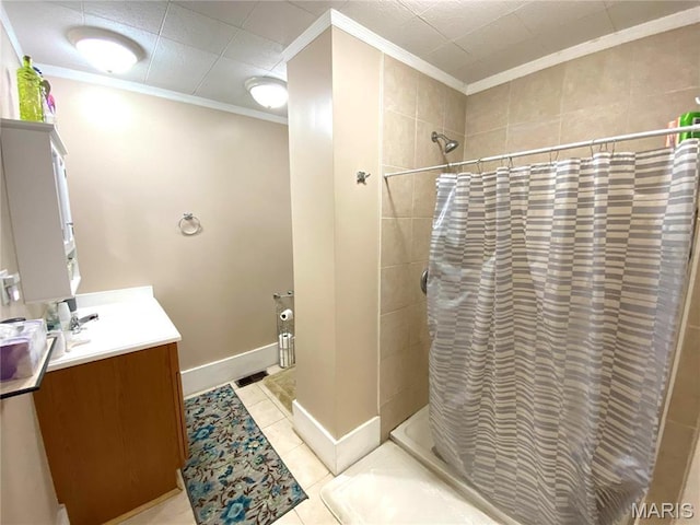 111 SE St, Wellsville, MO 63384 - bathroom with crown molding, tiled shower, tile patterned floors, vanity, and baseboards