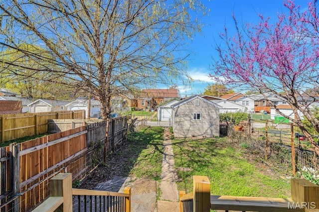 4021 Winnebago St, Saint Louis, MO 63116 - fenced backyard with a residential view, a storage shed, and an outdoor structure