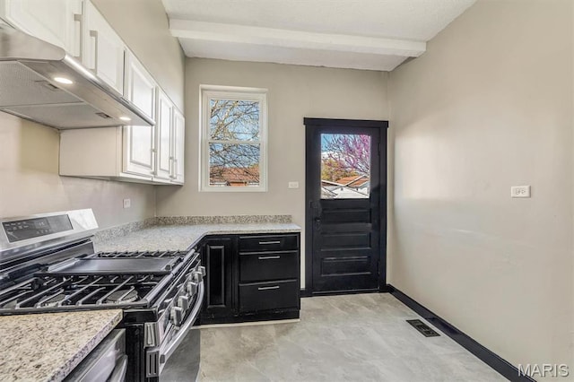 4021 Winnebago St, Saint Louis, MO 63116 - kitchen featuring stainless steel range with gas cooktop, extractor fan, white cabinetry, baseboards, and beam ceiling