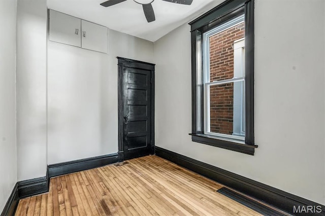 4021 Winnebago St, Saint Louis, MO 63116 - unfurnished room with wood-type flooring, baseboards, and a ceiling fan