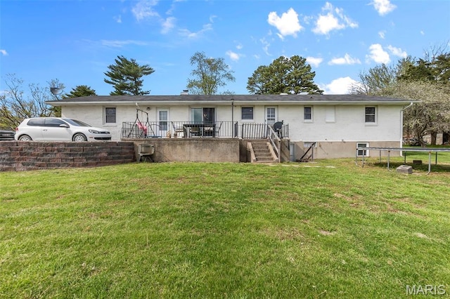 rear view of property with a yard