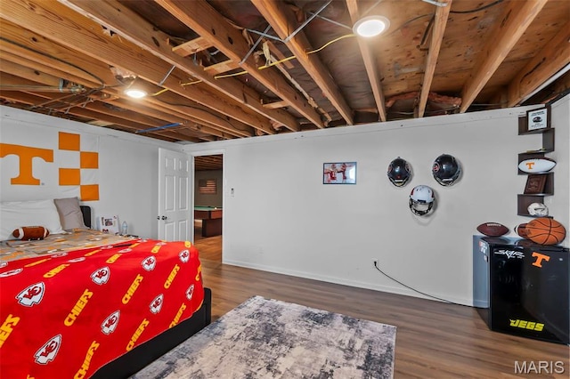bedroom with wood finished floors