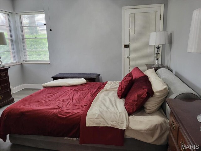 8303 Knollwood Dr, Saint Louis, MO 63121 - bedroom with wood finished floors and baseboards