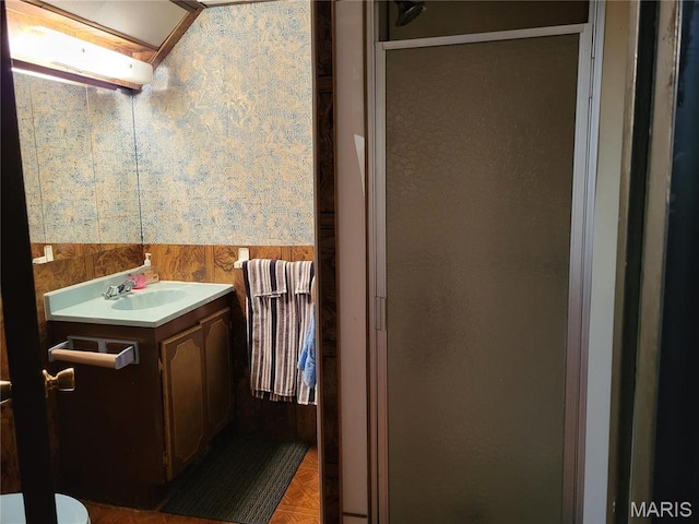 8303 Knollwood Dr, Saint Louis, MO 63121 - full bath featuring a shower stall, vanity, wainscoting, and wood walls