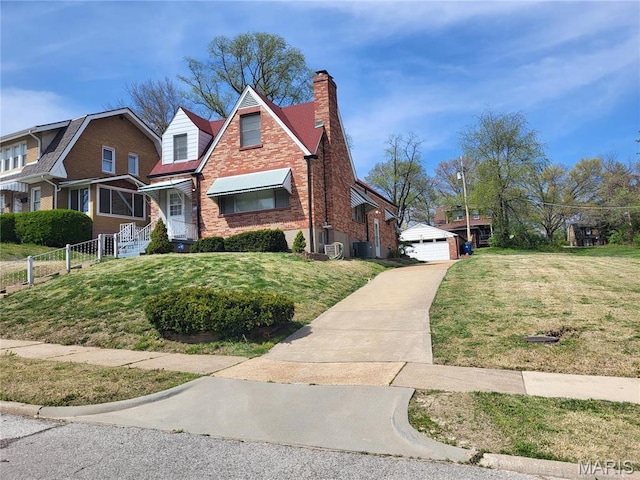 8303 Knollwood Dr, Saint Louis, MO 63121 - view of front of property featuring brick siding, a chimney, central air condition unit, a detached garage, and an outdoor structure