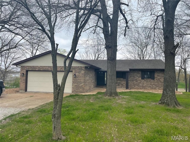 5826 Grandview Ter, Waterloo, IL 62298 - view of front of house with brick siding, a garage, concrete driveway, a front lawn, and roof with shingles