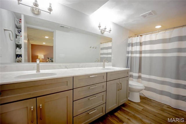 5826 Grandview Ter, Waterloo, IL 62298 - full bath with wood finished floors, double vanity, toilet, and curtained shower