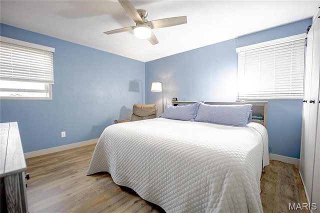 5826 Grandview Ter, Waterloo, IL 62298 - bedroom featuring wood finished floors, baseboards, and ceiling fan