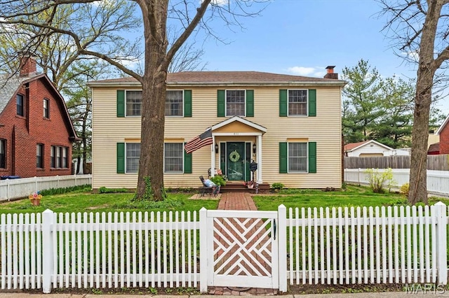 411 S High St, Belleville, IL 62220 - colonial home featuring a chimney