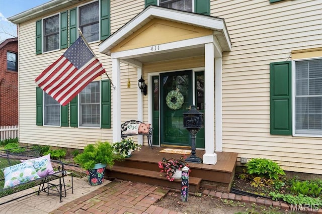 411 S High St, Belleville, IL 62220 - view of exterior entry with fence and a patio area
