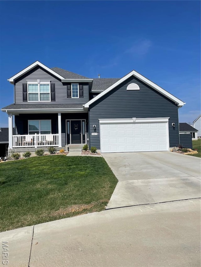 809 Colony Ridge Ct, Foristell, MO 63348 - traditional home with a garage, driveway, covered porch, and a front yard