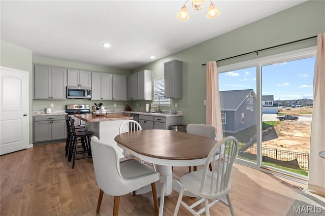 809 Colony Ridge Ct, Foristell, MO 63348 - dining space featuring healthy amount of natural light, wood finished floors, and recessed lighting