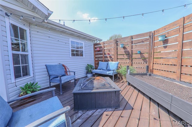 2605 Buenger Blvd, Granite City, IL 62040 - deck with fence and an outdoor living space with a fire pit