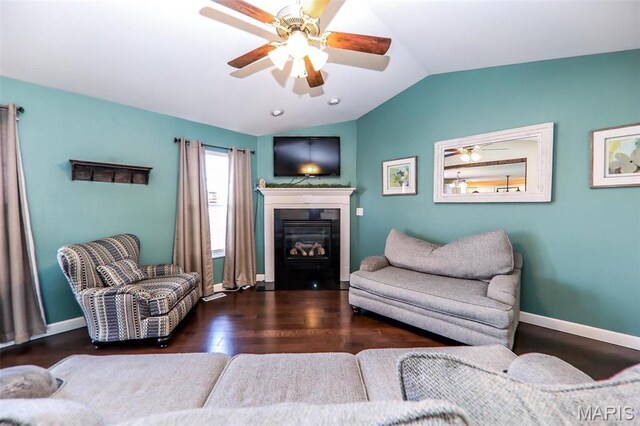 2605 Buenger Blvd, Granite City, IL 62040 - living room featuring vaulted ceiling, wood finished floors, ceiling fan, a glass covered fireplace, and baseboards