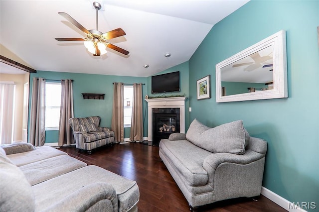 2605 Buenger Blvd, Granite City, IL 62040 - living area featuring lofted ceiling, a ceiling fan, baseboards, a glass covered fireplace, and wood finished floors