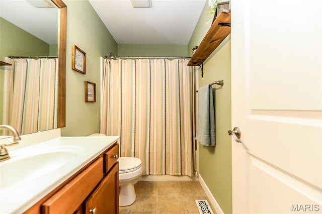 2605 Buenger Blvd, Granite City, IL 62040 - full bath featuring toilet, vanity, tile patterned floors, curtained shower, and baseboards