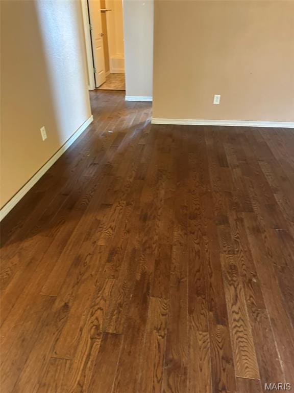 142 Oregon Ln, Kimberling City, MO 65686 - unfurnished room featuring dark wood-style floors and baseboards