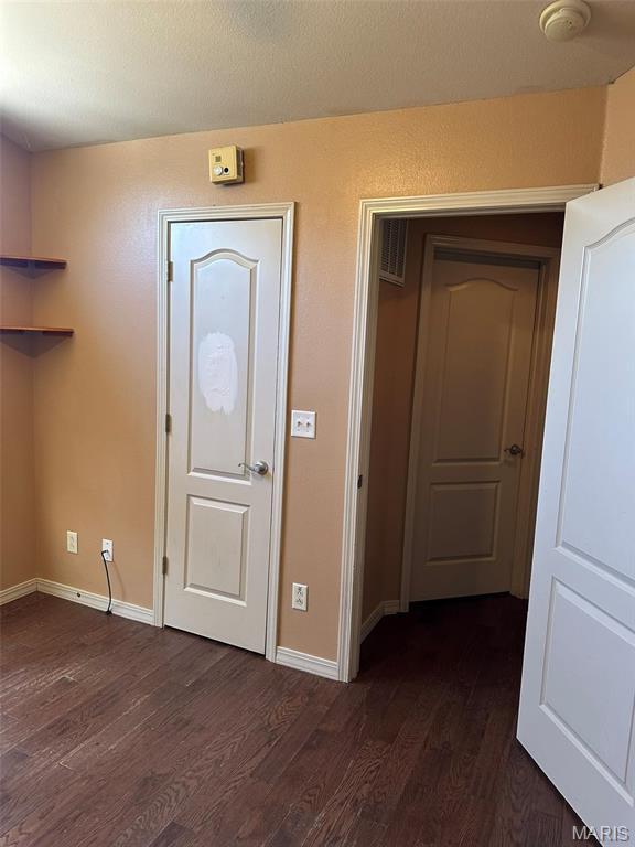 142 Oregon Ln, Kimberling City, MO 65686 - hall with dark wood finished floors and baseboards