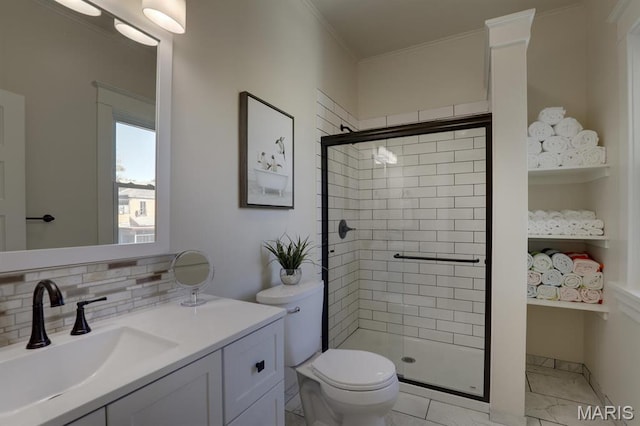 full bath featuring a stall shower, toilet, ornamental molding, backsplash, and vanity