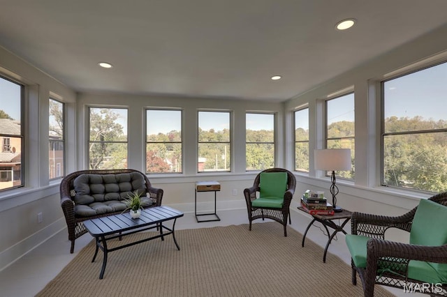 sunroom / solarium featuring recessed lighting and baseboards