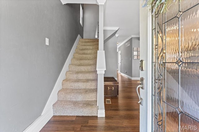 3884 Wyoming St, Saint Louis, MO 63116 - entryway with stairway, wood finished floors, ornamental molding, and baseboards