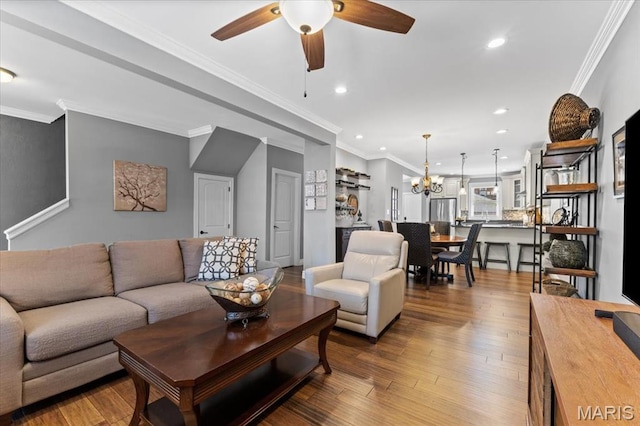 3884 Wyoming St, Saint Louis, MO 63116 - living room with ceiling fan, recessed lighting, a chandelier, wood finished floors, and crown molding