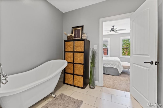 3884 Wyoming St, Saint Louis, MO 63116 - ensuite bathroom featuring a soaking tub, ceiling fan, and tile patterned floors