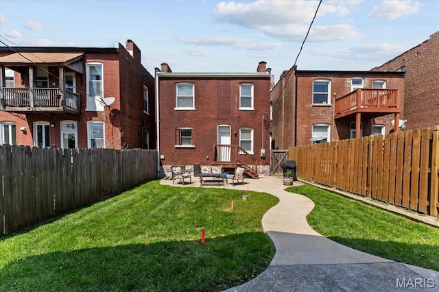 3884 Wyoming St, Saint Louis, MO 63116 - back of house featuring brick siding and a patio area