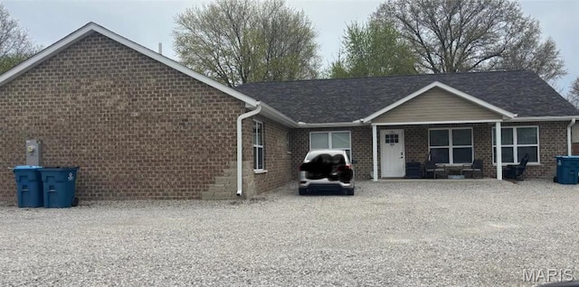 329 Rutledge St, Worden, IL 62097 - rear view of property with brick siding and roof with shingles