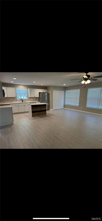 329 Rutledge St, Worden, IL 62097 - unfurnished living room with ceiling fan and wood finished floors