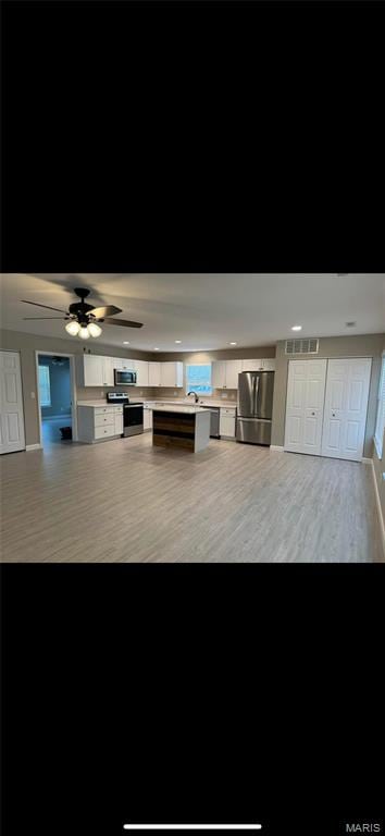 329 Rutledge St, Worden, IL 62097 - unfurnished living room featuring wood finished floors, recessed lighting, baseboards, and ceiling fan